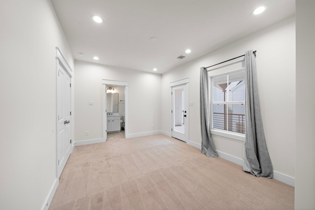 empty room with light colored carpet