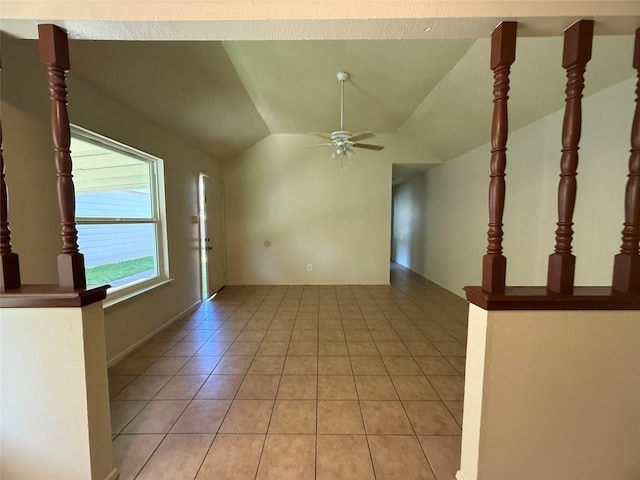 unfurnished living room featuring ceiling fan, light tile patterned floors, and lofted ceiling