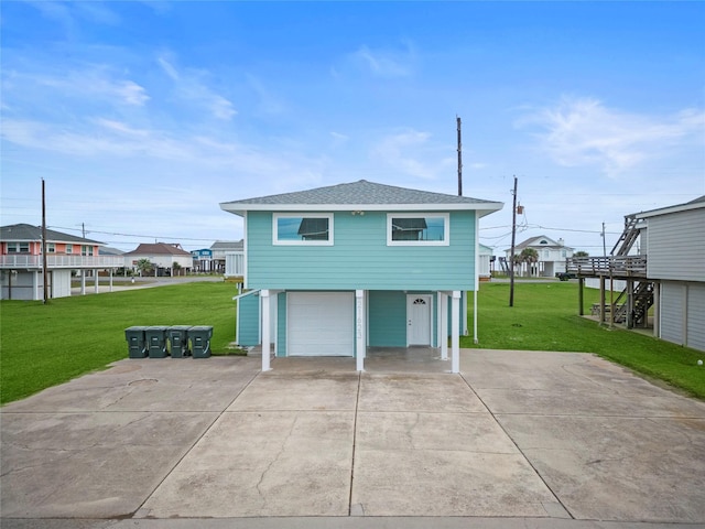 exterior space featuring a garage and a front lawn