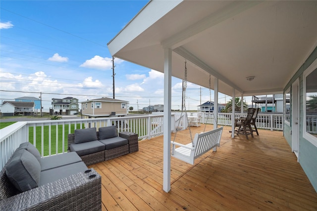 deck with a lawn and an outdoor living space