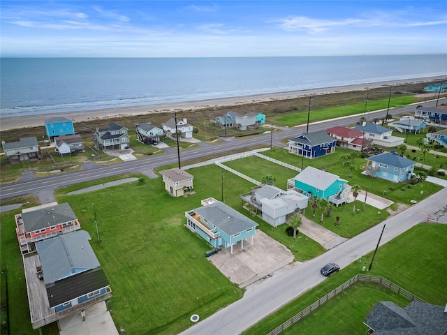 bird's eye view with a view of the beach and a water view