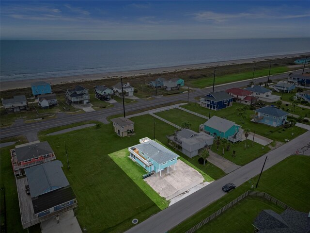 bird's eye view featuring a water view and a view of the beach