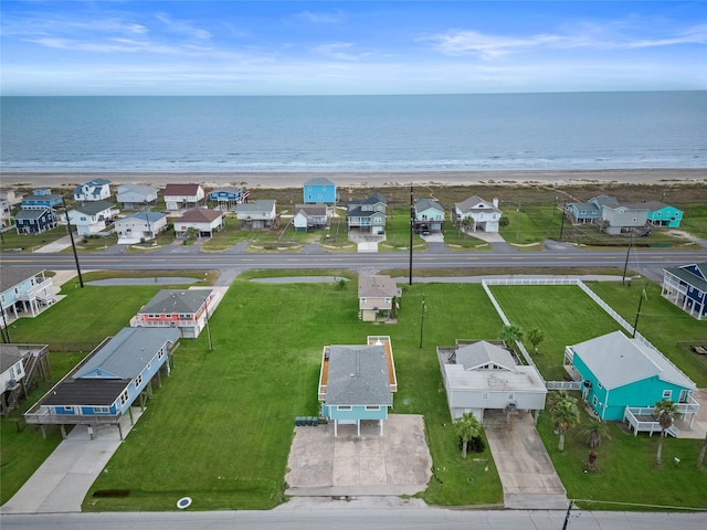 bird's eye view with a water view and a view of the beach