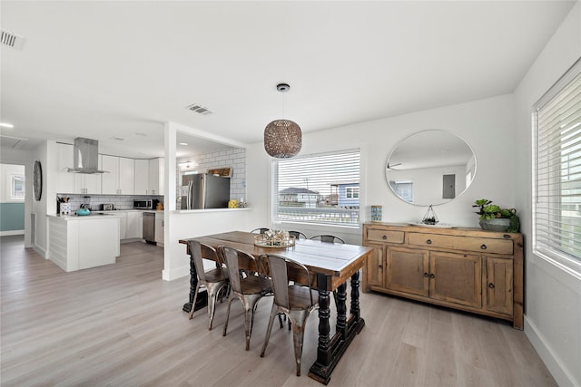 dining room with light hardwood / wood-style floors