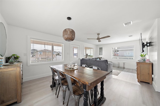 dining area featuring ceiling fan and light hardwood / wood-style flooring