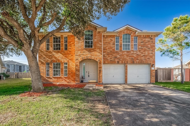 view of front of house featuring a front lawn and a garage