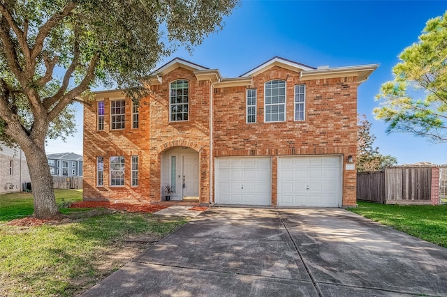 view of front of property with a front lawn and a garage