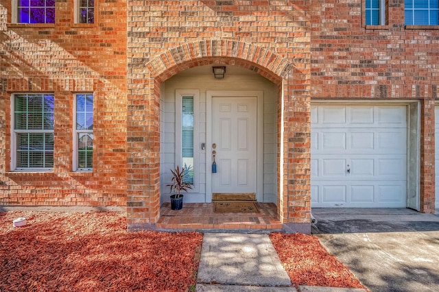 view of exterior entry featuring a garage