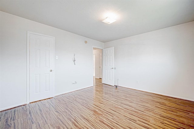 spare room featuring light hardwood / wood-style floors