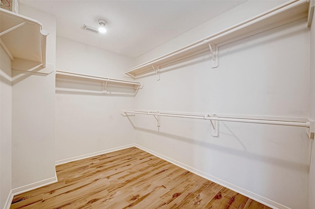 walk in closet featuring wood-type flooring