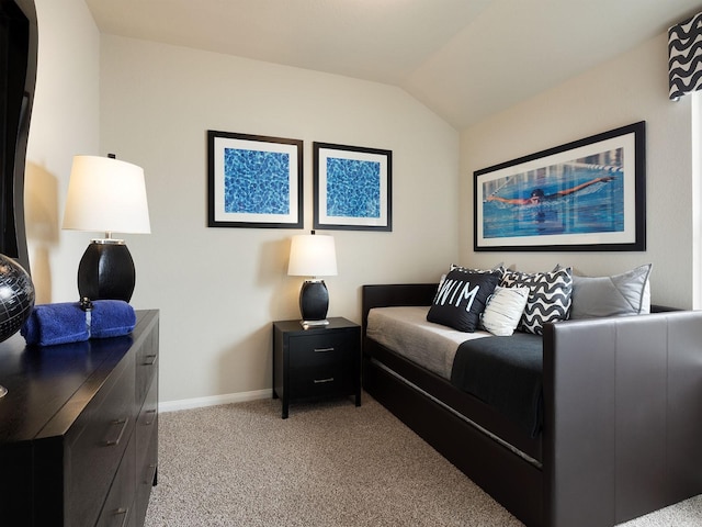 bedroom featuring light carpet and lofted ceiling