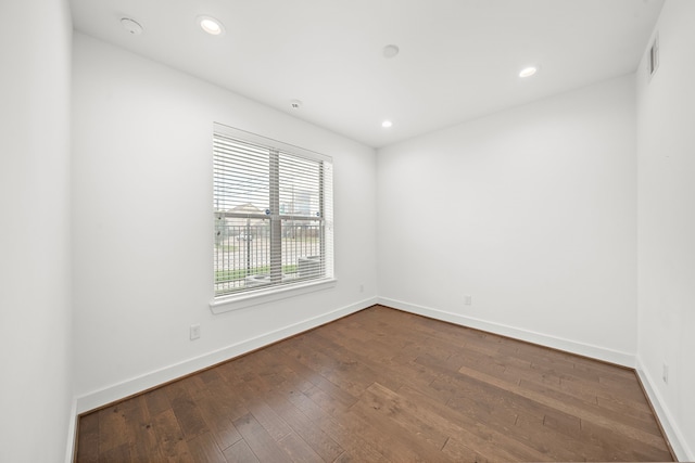 empty room with wood-type flooring