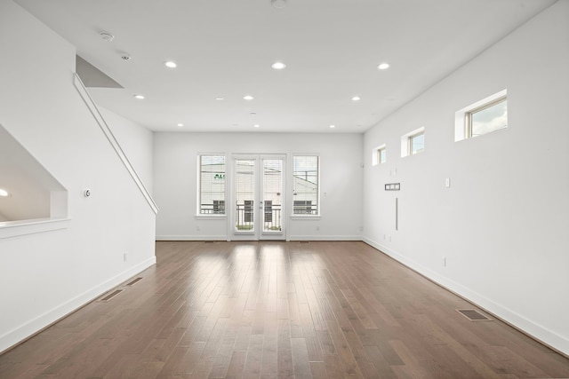 unfurnished living room featuring dark hardwood / wood-style flooring