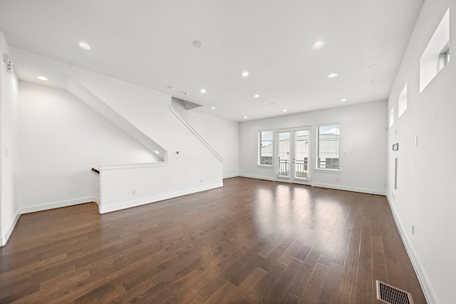 unfurnished living room featuring dark hardwood / wood-style flooring