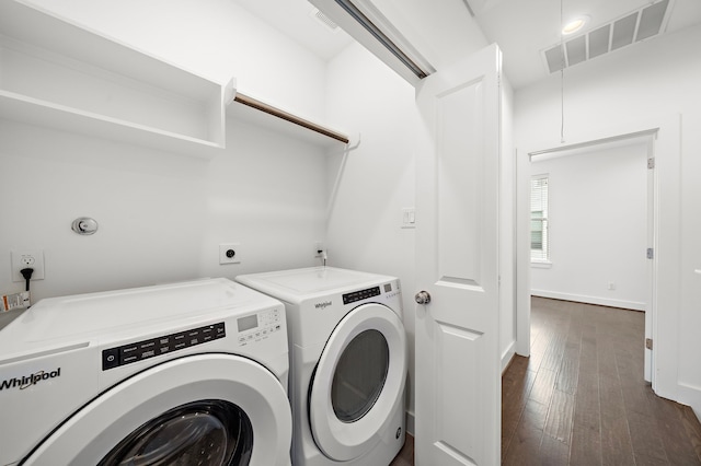 laundry room featuring dark hardwood / wood-style flooring and washing machine and clothes dryer