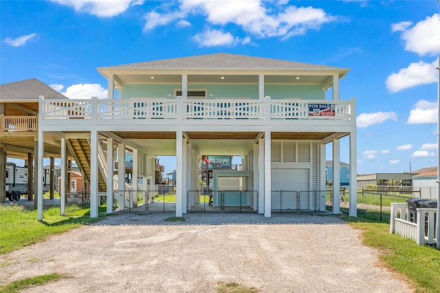 raised beach house with a carport