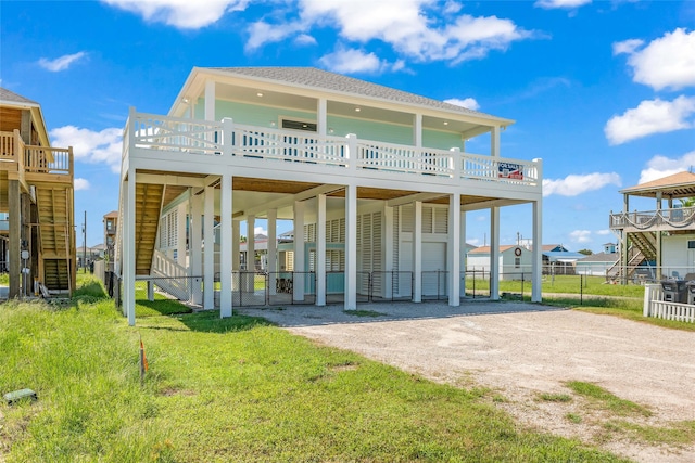 rear view of house with a yard