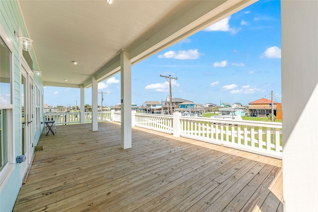 wooden deck featuring a water view