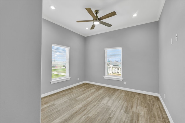 unfurnished room with ceiling fan, light wood-type flooring, and crown molding