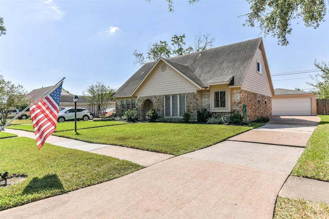 view of front of house featuring a garage and a front yard