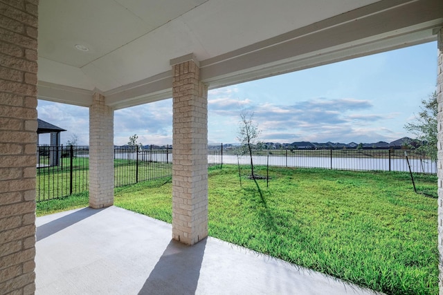 view of patio featuring a water view