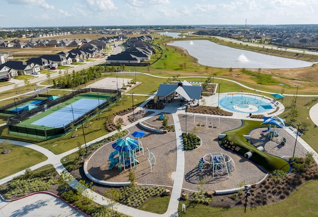 birds eye view of property with a water view