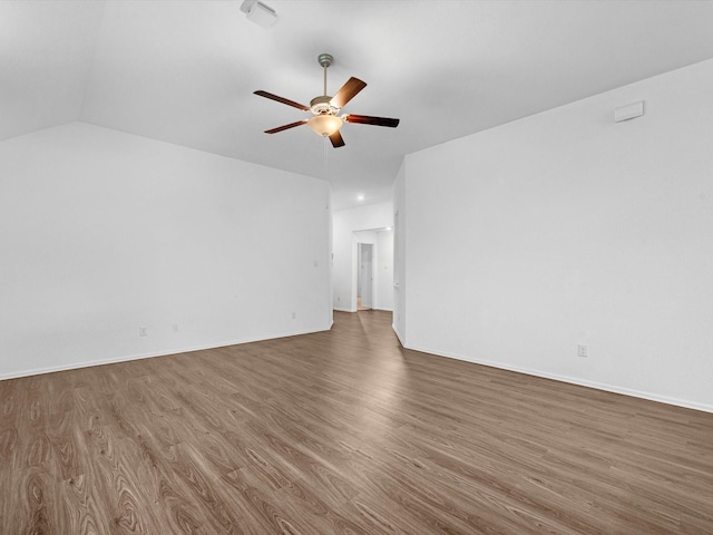 unfurnished living room with ceiling fan, dark hardwood / wood-style floors, and vaulted ceiling