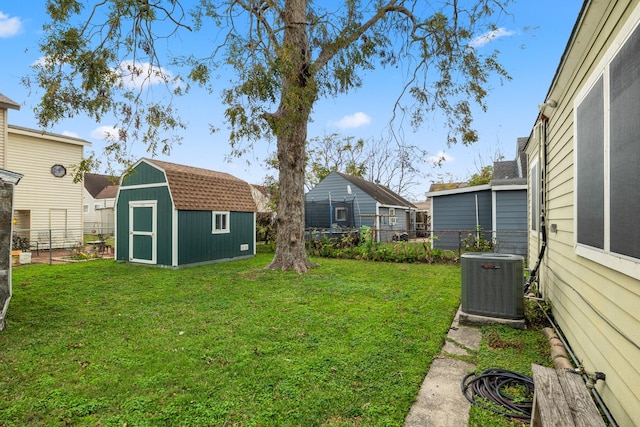 view of yard with a storage shed and central air condition unit