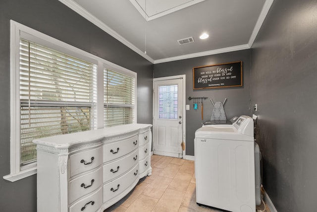 laundry room featuring light tile patterned flooring, washing machine and dryer, and ornamental molding