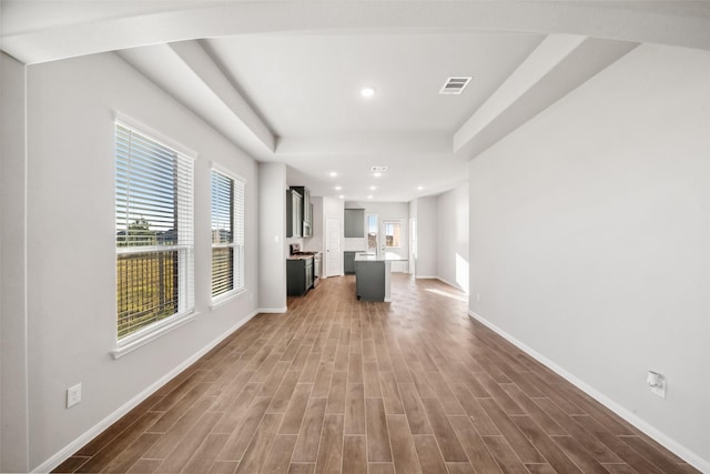 unfurnished living room featuring dark wood-type flooring