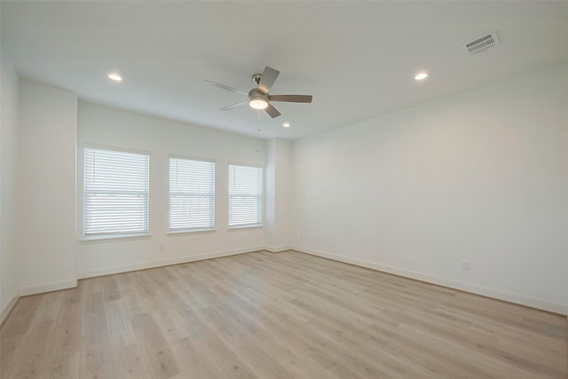 unfurnished room featuring ceiling fan and light hardwood / wood-style flooring