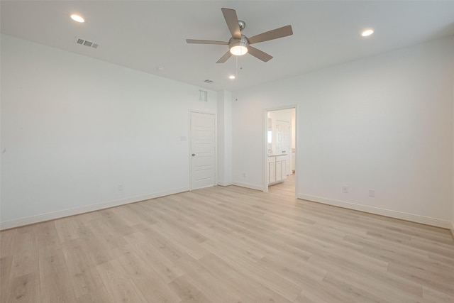 empty room with light wood-type flooring and ceiling fan