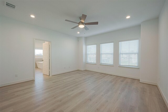 unfurnished room featuring light hardwood / wood-style flooring and ceiling fan