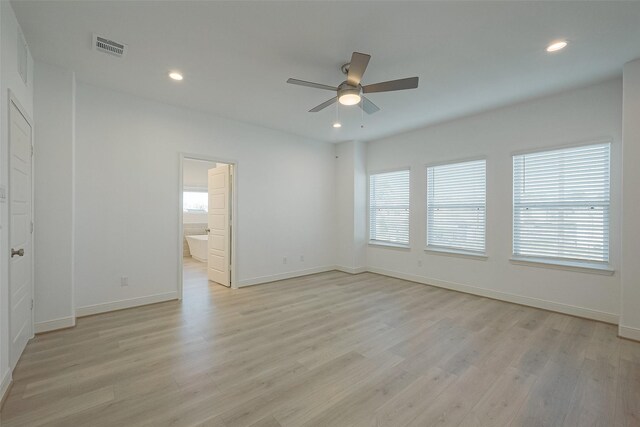 unfurnished room with ceiling fan and light wood-type flooring