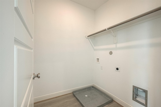 laundry room featuring hookup for an electric dryer, hookup for a washing machine, and wood-type flooring