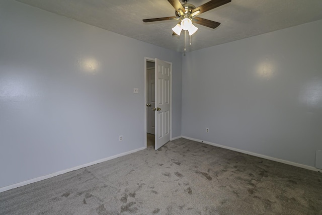 unfurnished room with carpet flooring and ceiling fan