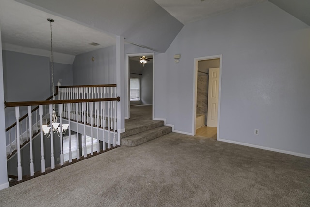 interior space with carpet floors, vaulted ceiling, and ceiling fan