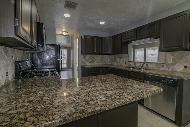 kitchen with kitchen peninsula, dishwasher, stove, and sink