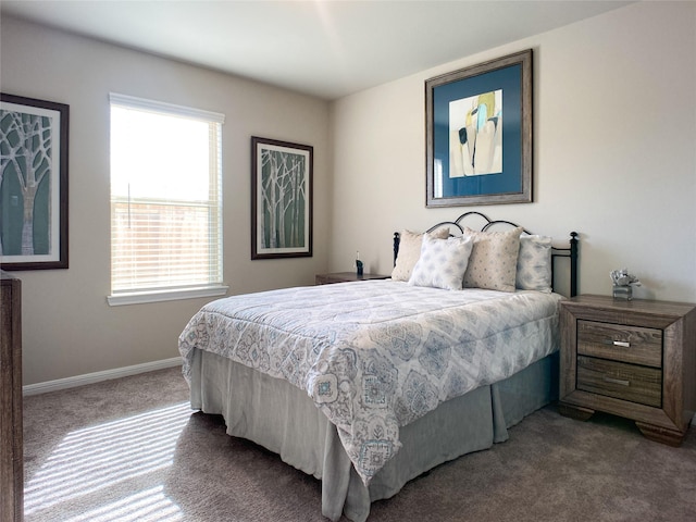 carpeted bedroom featuring multiple windows