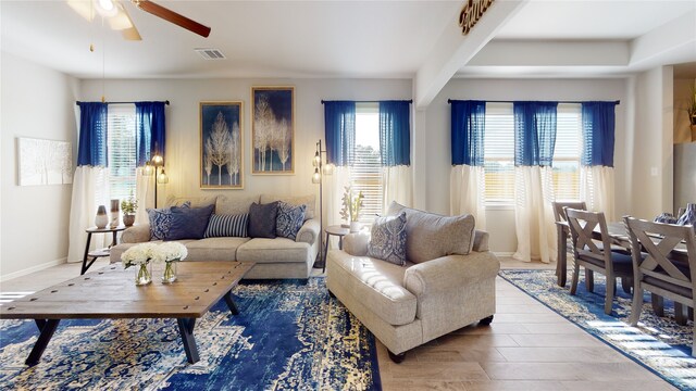 living room featuring ceiling fan and hardwood / wood-style floors