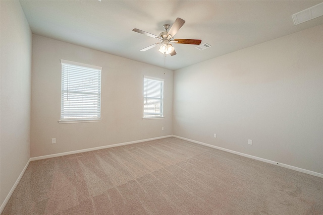 empty room with light carpet and ceiling fan