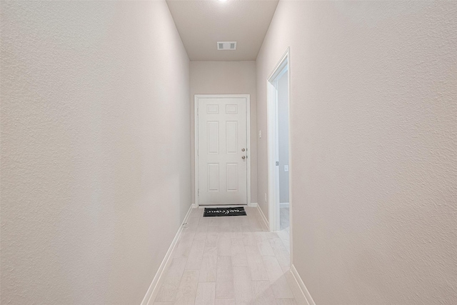 hallway featuring light wood-type flooring