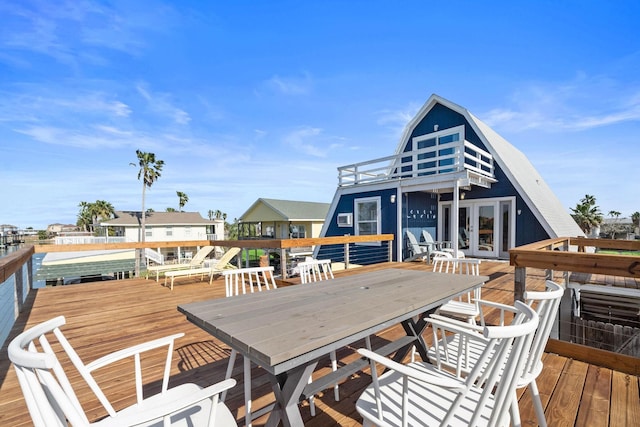 wooden deck featuring french doors