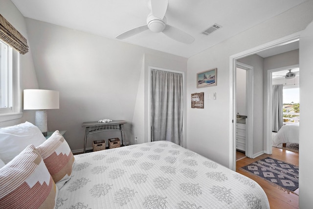 bedroom with light hardwood / wood-style flooring and ceiling fan