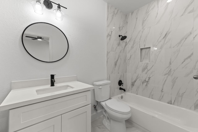 full bathroom with vanity, tiled shower / bath combo, and toilet