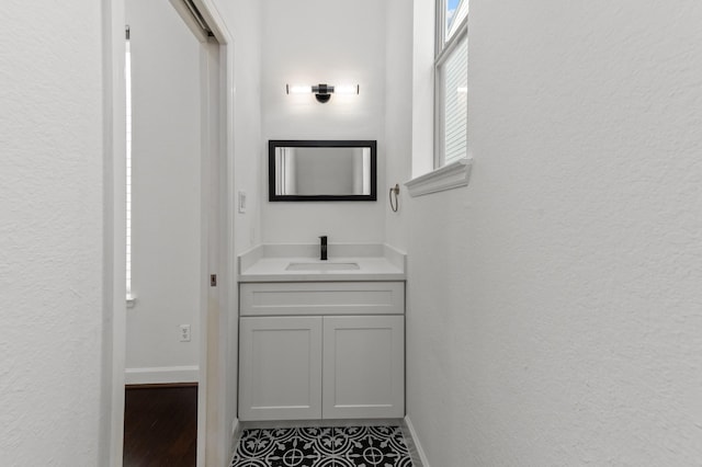 bathroom with tile patterned flooring and vanity