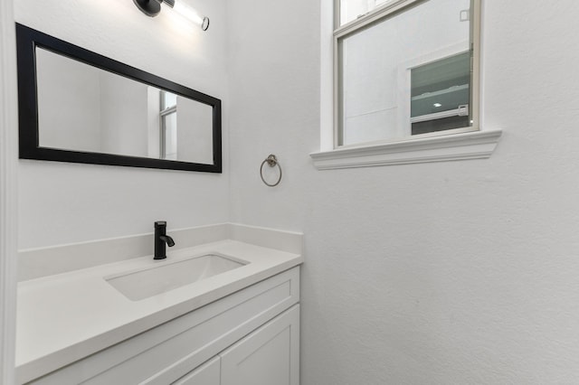 bathroom featuring vanity and a healthy amount of sunlight