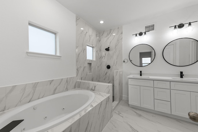 bathroom with vanity and independent shower and bath