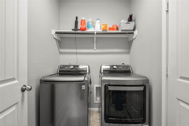 laundry room with independent washer and dryer