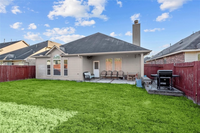 rear view of property featuring an outdoor hangout area, a patio area, and a yard